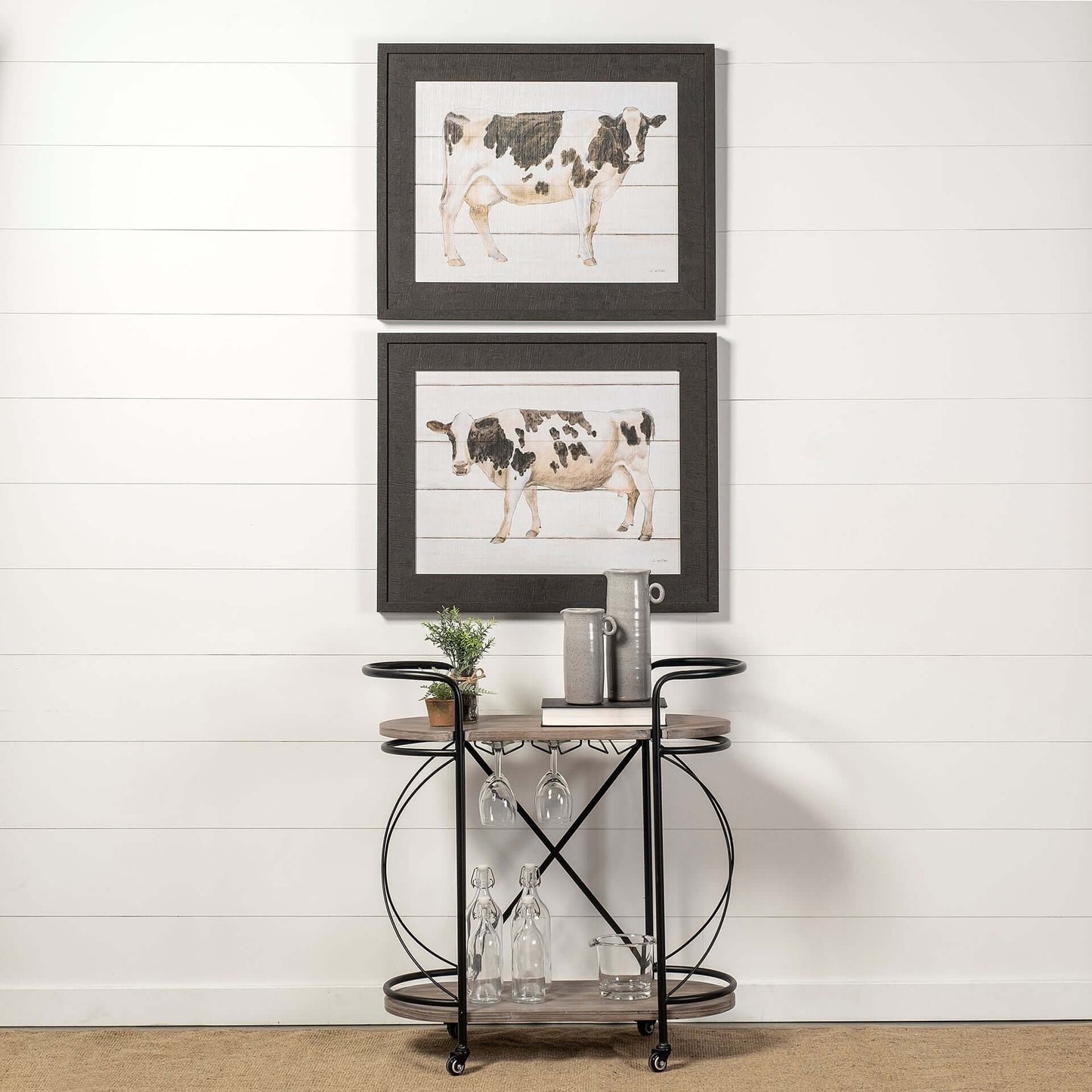Black Solid Wood and Steel Rolling Kitchen Cart With Storage featuring artistic cow prints above.