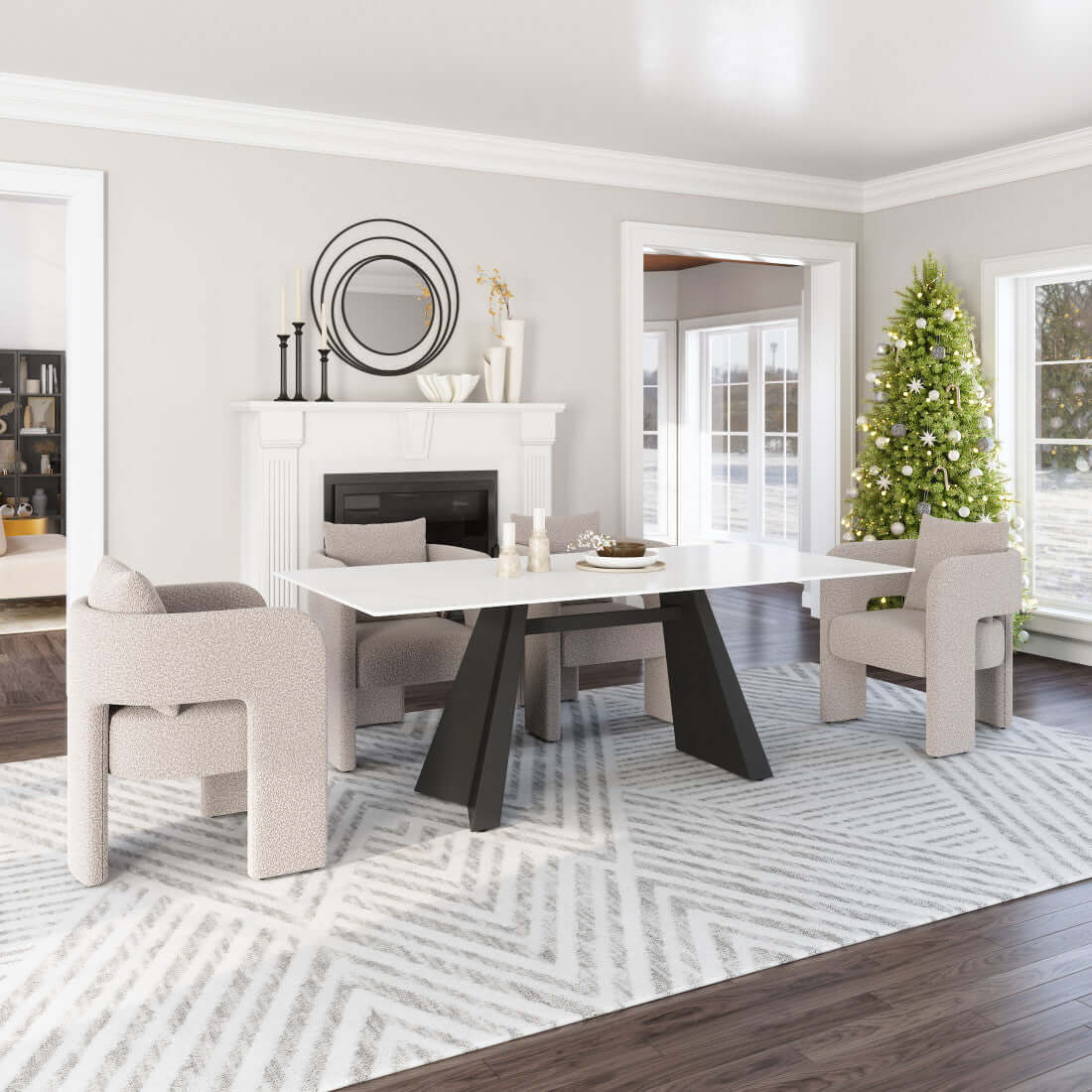White and Black Sintered Double Pedestal Base Dining Table set in a modern dining room with cozy chairs and festive decor.