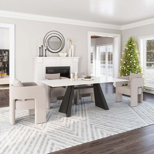 White and Black Sintered Double Pedestal Base Dining Table set in a modern dining room with cozy chairs and festive decor.
