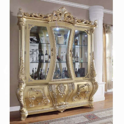 ACME Cabriole curio cabinet featuring ornate gold design and glass shelves for elegant display of collectibles.