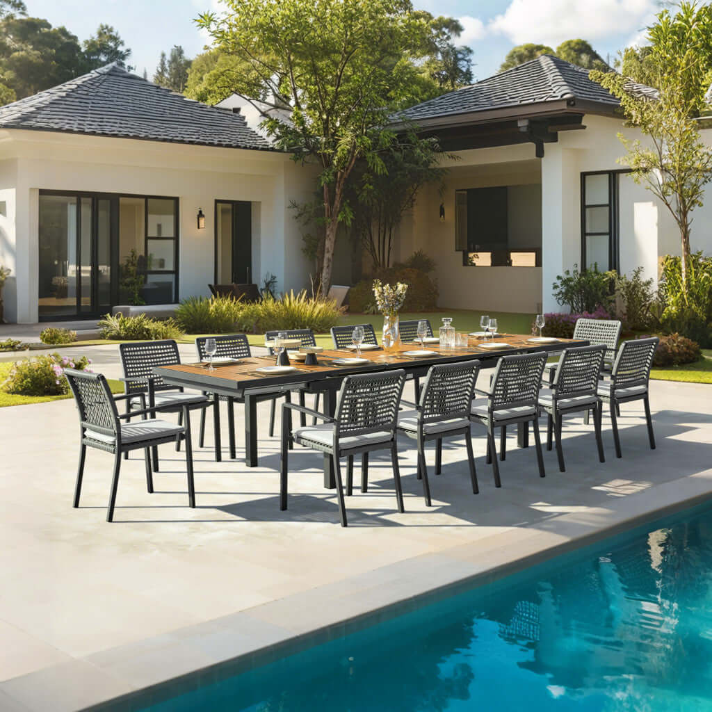 HOMEROOTS 13 Piece Natural and Black Solid Wood Dining Set displayed outdoors by the poolside, perfect for entertaining.