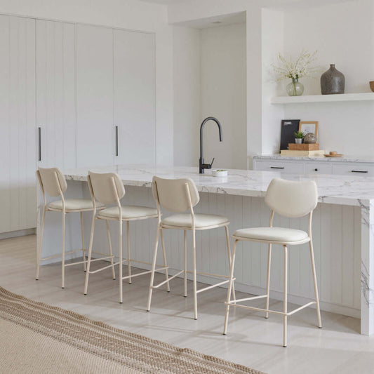 Homeroots 4 Set Gray Bar Chairs Counter Height Steel Frame arranged at a kitchen island.