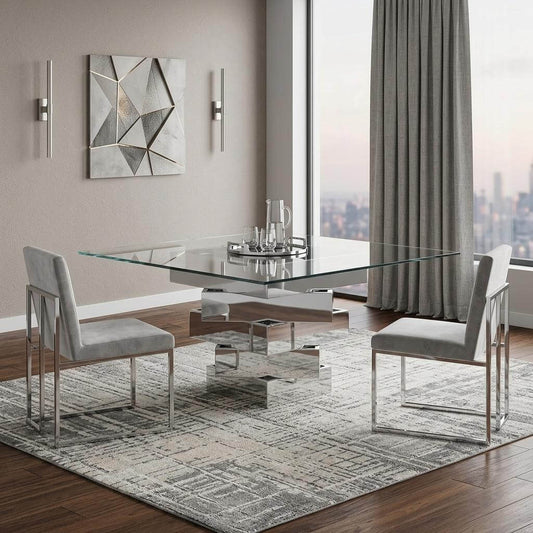 Homeroots 59 Clear And Gray Glass Solid Wood Dining Table in a modern dining room with stylish chairs.
