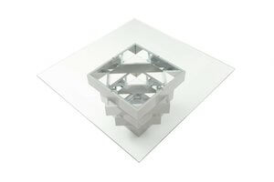 Homeroots 59 Clear And Gray Glass Solid Wood Dining Table showcasing modern design with a unique geometric structure.