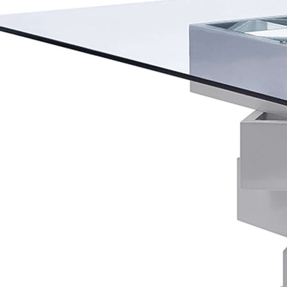 Homeroots 59 Clear And Gray Glass Solid Wood Dining Table with sleek glass top and solid wood base.
