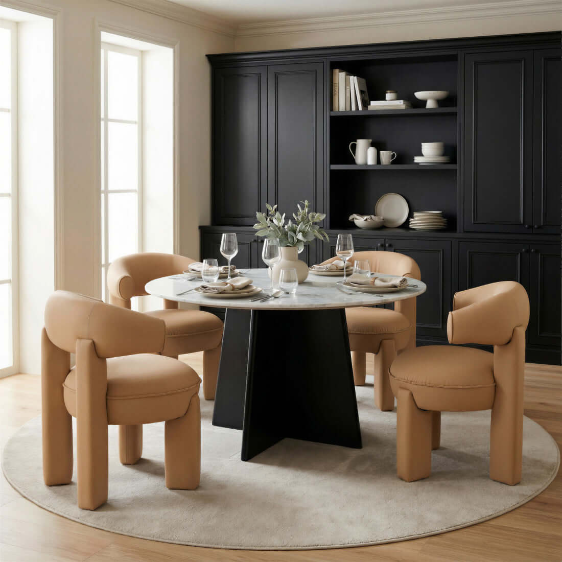White and Black Marble and Wood Round Top Dining Table set in a stylish dining space with modern chairs.