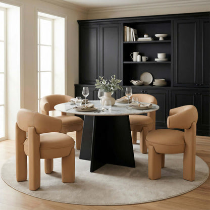 White and Black Marble and Wood Round Top Dining Table set in a stylish dining space with modern chairs.